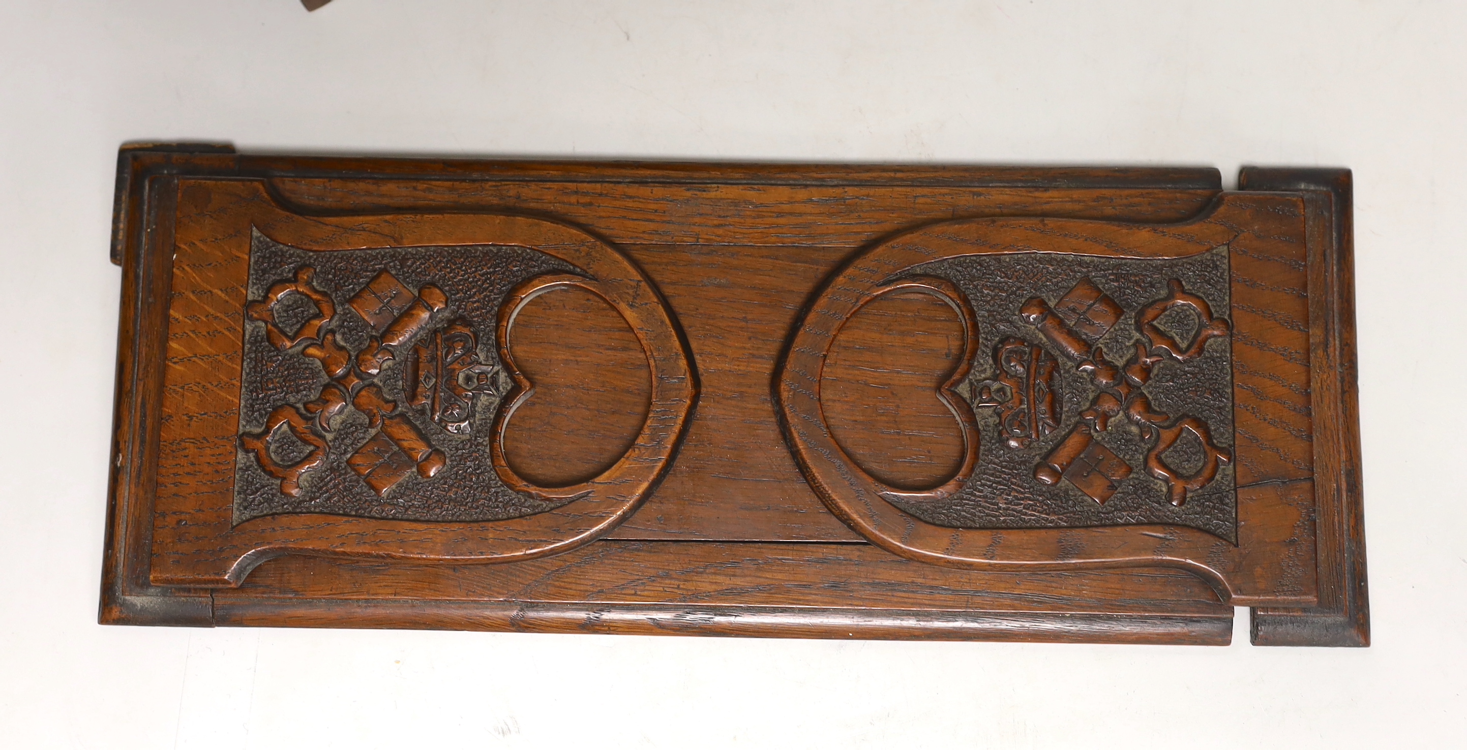 A miniature walnut chest of drawers and a bookslide, relating to the fire at York Minster, 34cm wide (closed)